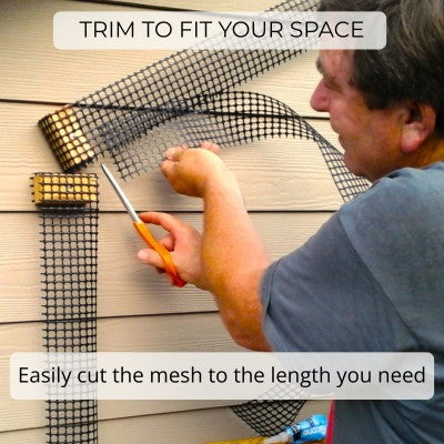 Scroll Trellis mesh being trimmed with household scissors to fit a shorter installation.